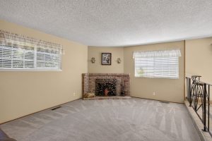 Family room with wood-burning fireplace